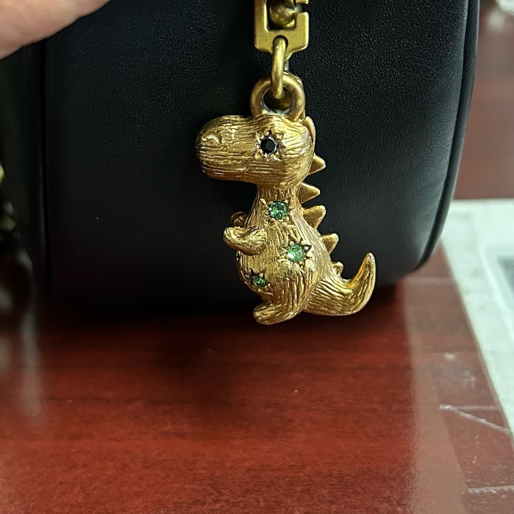 Coach brass dinosaur handbag charm